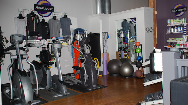 Gym interior with exercise equipment and apparel