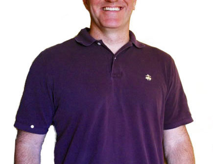 Smiling man in purple polo shirt