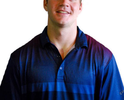 Smiling man in blue polo shirt