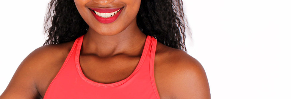 Smiling woman in red workout top