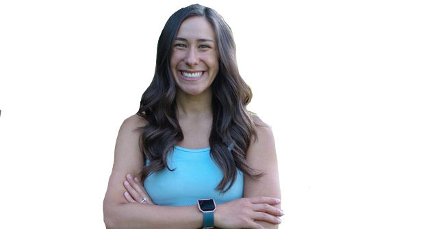 Smiling woman wearing tank top and smartwatch