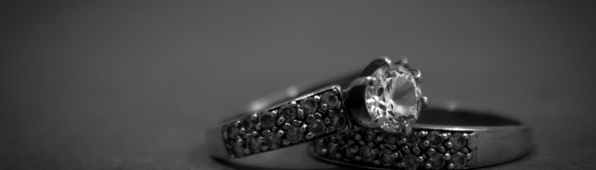 Close-up of diamond engagement and wedding rings