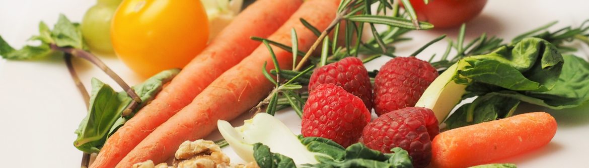 Assorted fresh vegetables with raspberries