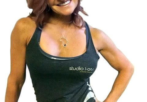 Smiling fit woman in black workout tank