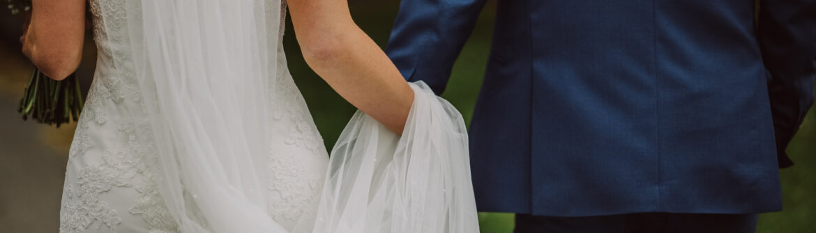 Bride and groom walking hand in hand